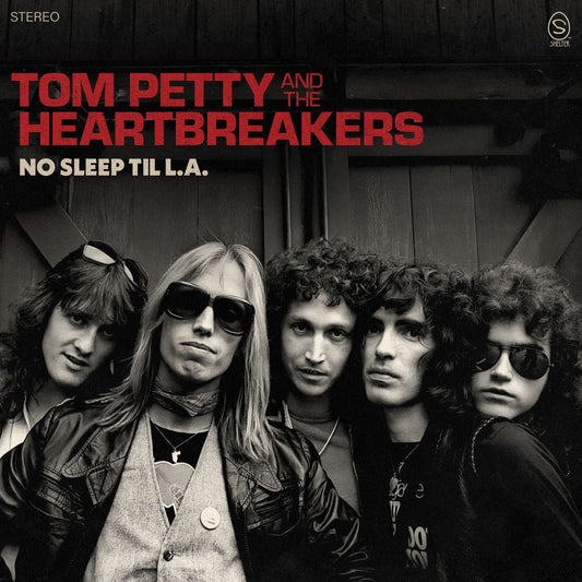 the album cover for Tom Petty And The Heartbreakers - No Sleep Til L.A. [Indie Exclusive Galaxy Ruby Translucent Black Opaque 180g]